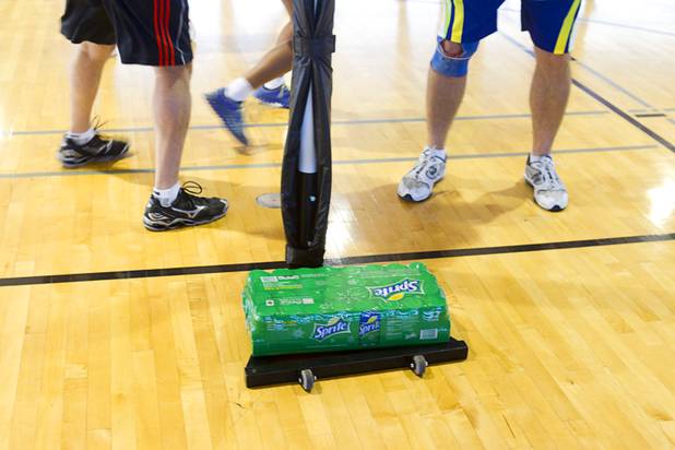 A case of Sprite weights down a basket during the 2012 CallidusCloud U.S. Open Netball Championships at UNLV campus Sunday, November 11, 2012. Netball is similar to basketball but there is no running or dribbling and the ball must be passed in three seconds. Also there is no backboard and players are designated to certain areas of the court.