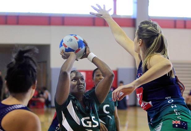 Stacy Ross, center, of the Southeast Strikers, takes a shot against Brothers Netball Club of Australia in the women's finals match during the 2012 CallidusCloud U.S. Open Netball Championships at UNLV campus Sunday, November 11, 2012.