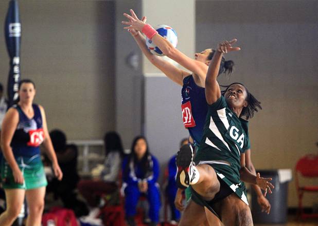 Zoe Seibold of Brothers Netball Club of Australia and Sharon Wiles-Smith of the Southeast Strikers jump for a ball in the women's finals match during the 2012 CallidusCloud U.S. Open Netball Championships at UNLV campus Sunday, November 11, 2012.