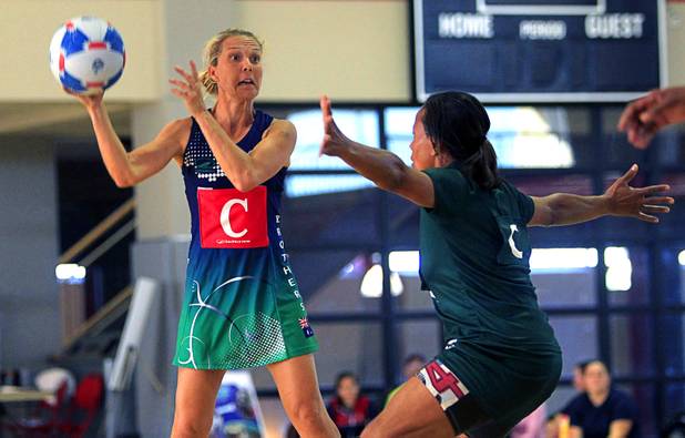 Wendy Evans, left, of Brothers Netball Club of Australia, looks to pass over Julia Edwards of the Southeast Strikersin the women's finals match during the 2012 CallidusCloud U.S. Open Netball Championships at UNLV campus Sunday, November 11, 2012.