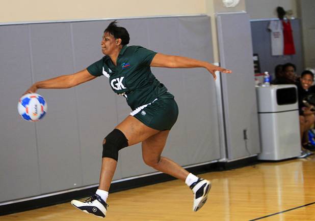 Hyacinth Douglas of the Southeast Strikers tries to keep a ball inbounds in the women's finals match against Brothers Netball Club of Australia during the 2012 CallidusCloud U.S. Open Netball Championships at UNLV campus Sunday, November 11, 2012. Netball is similar to basketball but there is no running or dribbling and the ball must be passed in three seconds. Also there is no backboard and players are designated to certain areas of the court.