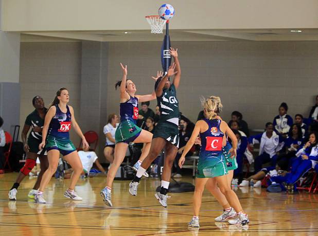 Players jump for the ball in the women's finals match pit ting the Southeast Strikers against Brothers Netball Club of Australia during the 2012 CallidusCloud U.S. Open Netball Championships at UNLV campus Sunday, November 11, 2012.