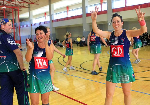 Tanya Shuker, left, and Zoe Seibold, of Brothers Netball Club of Australia, celebrate after winning the women's finals match over the Southeast Strikers during the 2012 CallidusCloud U.S. Open Netball Championships at UNLV campus Sunday, November 11, 2012.