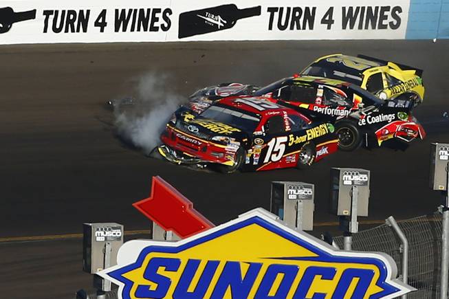From left, Clint Bowyer, Jeff Gordon and Joey Logano crash in Turn 4 during the NASCAR Sprint Cup Series race at Phoenix International Raceway on Sunday, Nov. 11, 2012, in Avondale, Ariz.