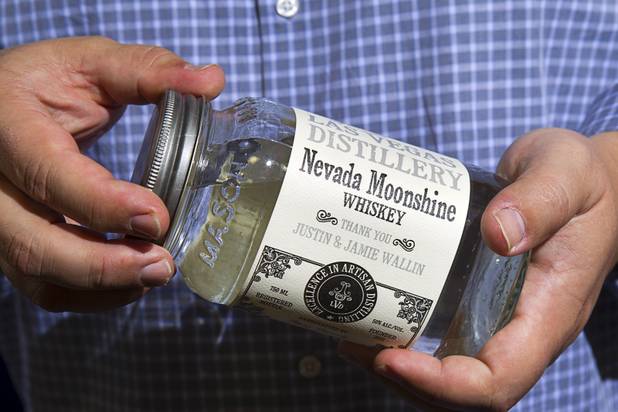 Las Vegas Distillery founder George Racz holds a Mason jar of Nevada Moonshine at the Las Vegas Distillery in Henderson Monday, Nov. 12, 2012. The distillery, at 7330 Eastgate Road, will celebrate the historic bottling of several new spirits -Nevada whiskey, rum, gin and moonshine- on Saturday, Nov. 17. The Mason Jar edition will be available after Thanksgiving, Racz said.
