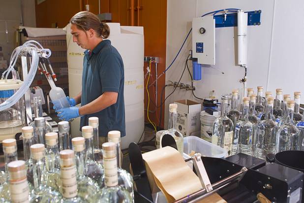 Stillman Sid Kindler fills a bottle at the Las Vegas Distillery in Henderson Monday, Nov. 12, 2012. The distillery, at 7330 Eastgate Road, will celebrate the historic bottling of several new spirits -Nevada whiskey, rum, gin and moonshine- on Saturday, Nov. 17. The company is already producing Nevada Vodka and Rumskey.
