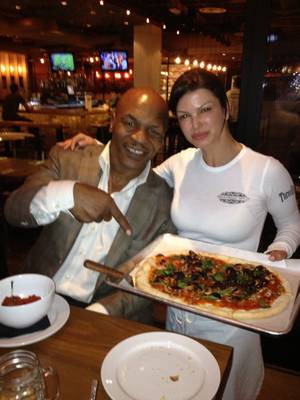 Mike Tyson and Carla Pellegrino at her Meatball Spot in Town Square.