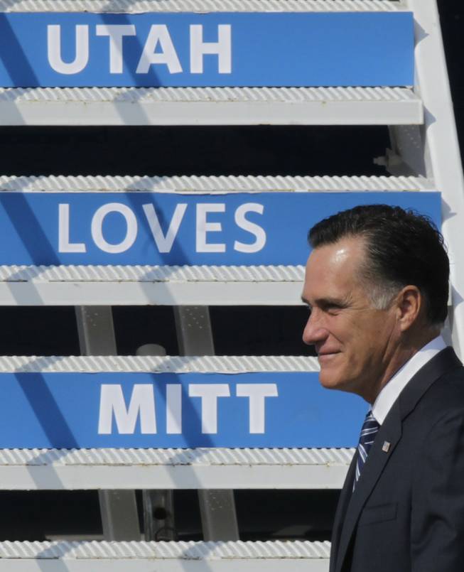 Republican presidential candidate and former Massachusetts Gov. Mitt Romney arrives at Salt Lake City International Airport during a visit to Utah for a pair of fundraisers Tuesday, Sept. 18, 2012, in Salt Lake City. 