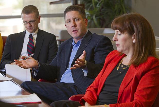 Doug Geinzer,center, CEO of the Southern Nevada Medical Industry Coalition, speaks during an economic roundtable discussion at the Las Vegas Sun Wednesday, November 14, 2012. Lori Nelson, vice president of corporate communications at Station Casinos, listens at right.
