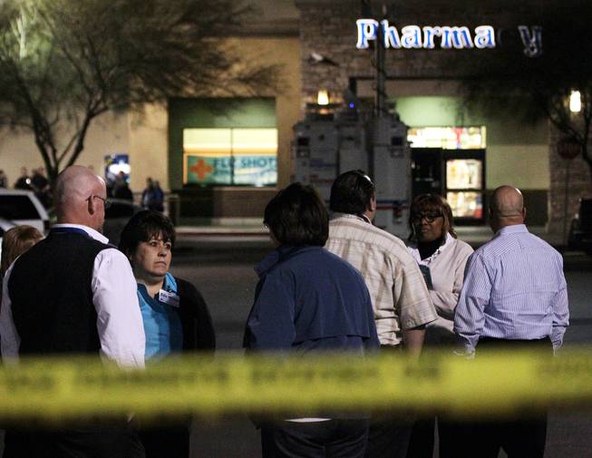 Employees of an Albertsons grocery store where Henderson Police shot a man Wednesday afternoon stand outside the store while police investigate the scene inside at the corner of Lake Mead Parkway and Boulder Highway in Henderson on Wednesday, November 14, 2012.