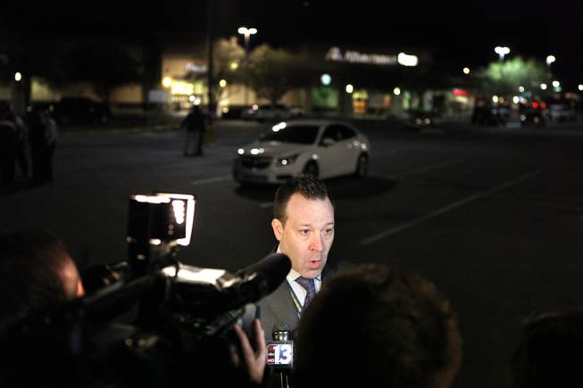 Henderson Police spokesman Keith Paul talks to the media outside of an Albertsons grocery store where Henderson Police shot a man Wednesday afternoon at the corner of Lake Mead Parkway and Boulder Highway in Henderson, Nov. 14, 2012.
