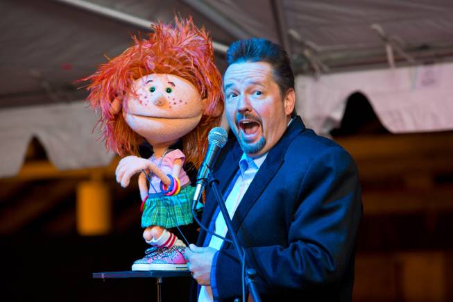 Terry Fator and Emma Taylor perform during the ceremonial opening of the Glittering Lights show at Las Vegas Motor Speedway, Thursday, Nov. 15, 2012.