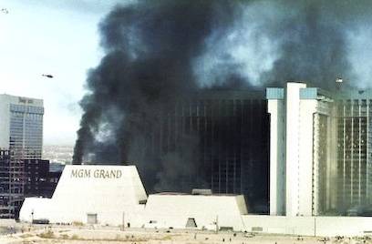 Smoke shoots out of the vents during the MGM Grand ...