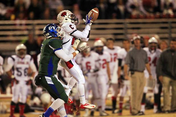 Coronado's Kieran Eissler nearly intercepts a pass intended for Green Valley's Kohorst Quintin during the Sunrise regional semifinal at Green Valley High School in Henderson Friday, November 16 , 2012. Quintin couldn't manage to complete the catch.