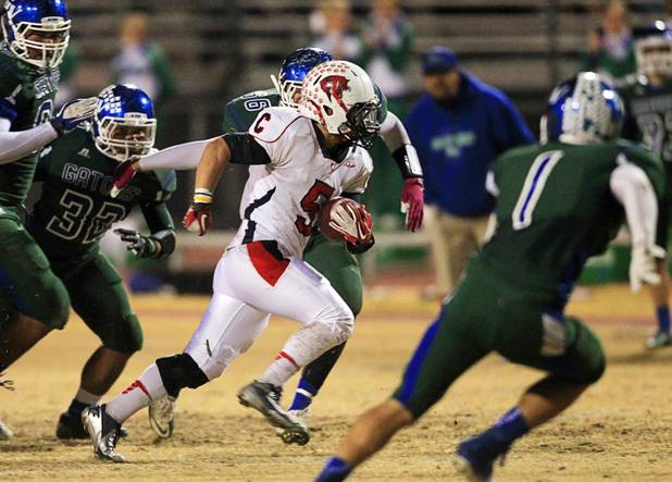 Coronado's Trevor Spina carries the ball against Green Valley during the Sunrise regional semifinal at Green Valley High School in Henderson Friday, November 16 , 2012.