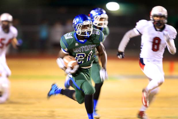 Green Valley's Gino Jonassanit carries the ball against Coronado during the Sunrise regional semifinal at Green Valley High School in Henderson Friday, November 16 , 2012.