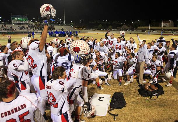 Coronado players celebrate after defeating Green Valley 29-14 during the Sunrise regional semifinal at Green Valley High School in Henderson Friday, November 16 , 2012.