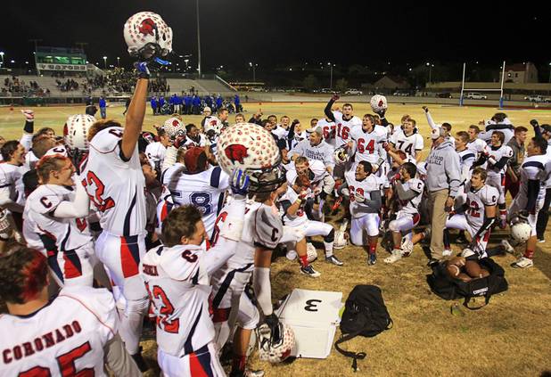 Coronado players celebrate after defeating Green Valley 29-14 during the Sunrise regional semifinal at Green Valley High School in Henderson Friday, November 16 , 2012.