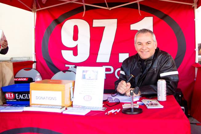 Scotty Allen from 97.1 The Point broacasts live from the HELP of Southern Nevada's Turkey-A-Thon, where they are collecting turkey donations for their charity Thanksgiving baskets, Friday, Nov. 16, 2012.