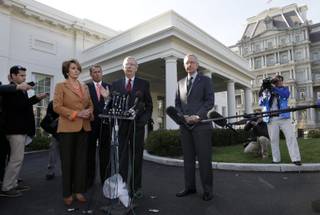 Senate Minority Leader Mitch McConnell of Ky., accompanied by, from left, House Minority Leader Nancy Pelosi of Calif., House Speaker John Boehner of Ohio, and Senate Majority Leader Harry Reid of Nev., speaks reporters outside the White House in Washington, Friday, Nov. 16, 2012, after meeting with President Barack Obama to discuss the economy and the deficit. 