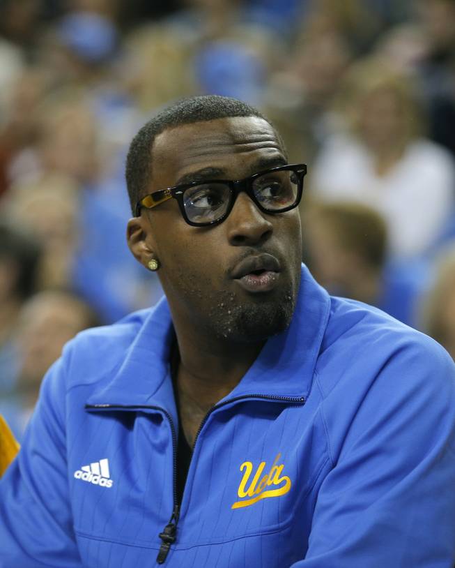 UCLA's Shabazz Muhammad looks on while sitting on the bench during the first half of an NCAA college basketball game against the Indiana State in Los Angeles, Nov. 9, 2012. 