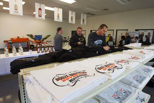 Rus Apfel looks over T-shirts at the Half Full Artisan Shop during the Historic First Edition Day at the Las Vegas Distillery in Henderson Saturday, November 17, 2012. The event marks the first bottling of several new spirits and the grand opening of the Booze Brothers Beverage distribution company and the Half Full Artisan Shop at the Distillery, a retail store. The spirits include Nevada vodka, whiskey, gin, rum and moonshine.