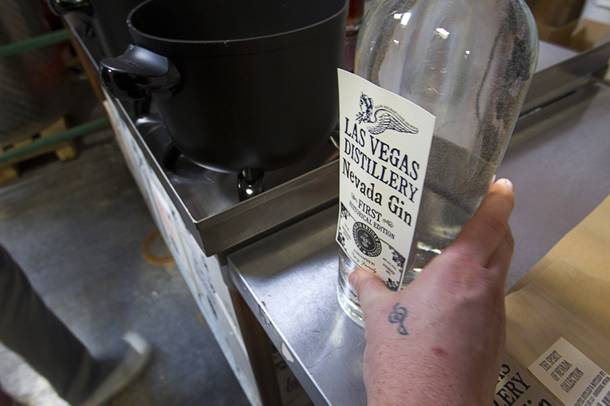 A label is applied to a bottle of Nevada Gin at a bottling station during the Historic First Edition Day at the Las Vegas Distillery in Henderson Saturday, November 17, 2012. The event marks the first bottling of several new spirits and the grand opening of the Booze Brothers Beverage distribution company and the Half Full Artisan Shop at the Distillery, a retail store. The spirits include Nevada vodka, whiskey, gin, rum and moonshine.