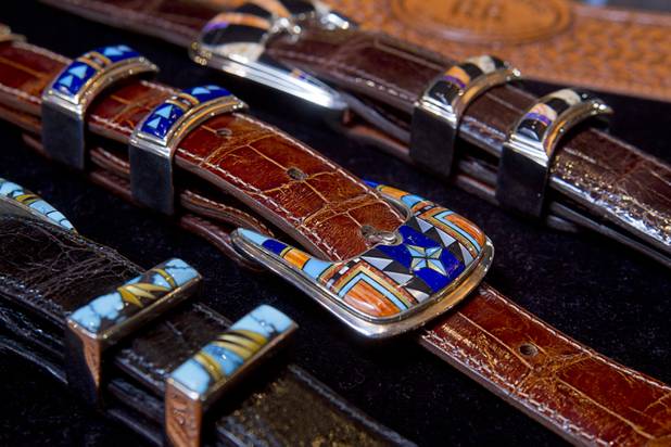 Mens inlaid buckle sets are displayed at the Pinto Ranch western wear store in the Fashion Show Mall Monday, November 19, 2012. The buckle sets are made by B. G. Mudd of Corrales, New Mexico.