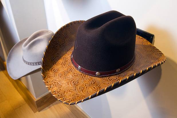 A hand-tooled woman's hat by Charlie 1 Horse hat company is displayed at the Pinto Ranch western wear store in the Fashion Show Mall Monday, November 19, 2012.