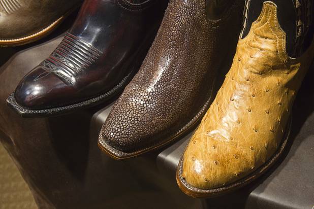 Lucchese boots with exotic leathers are displayed at the Pinto Ranch western wear store in the Fashion Show Mall Monday, November 19, 2012. The boot at center is made of stingray. The boot at right is made of ostrich.