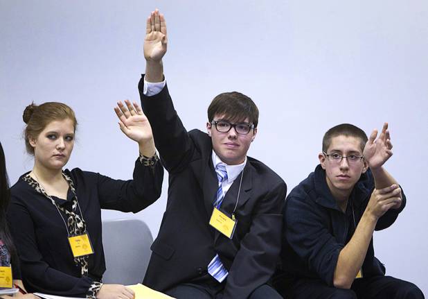 Tabby Reyes, left, of Foothill, Vincent Ackerman of Liberty and Joseph Bennecke of Desert Oasis High School wait to join a discussion during the annual Las Vegas Sun Youth Forum at the Las Vegas Convention Center Tuesday, November 20, 2012.