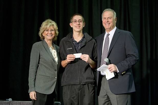 Scholarship winner Joseph Bennecke of Desert Oasis High School poses with Janie Greenspun-Gale and Brian Greenspun during the annual Las Vegas Sun Youth Forum at the Las Vegas Convention Center Tuesday, November 20, 2012.