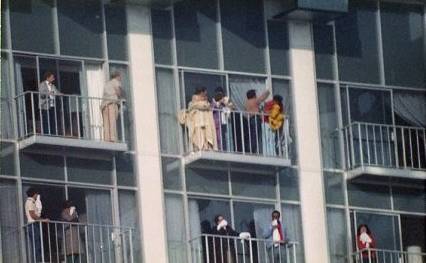 People are seen waiting on their balconies for rescue crews during the MGM Grand Nov. 21, 1980, fire.