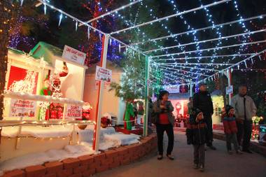 People stroll through Opportunity Village’s Magical Forest Wednesday, Nov. 21,&nbsp;2012.