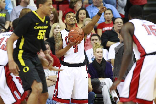 UNLV guard Anthony Marshall directs his teammates before inbounding the ball during their game against Oregon Friday, Nov. 23, 2012 in the Global Sports Classic. Oregon upset the 18th-ranked Rebels 83-79.