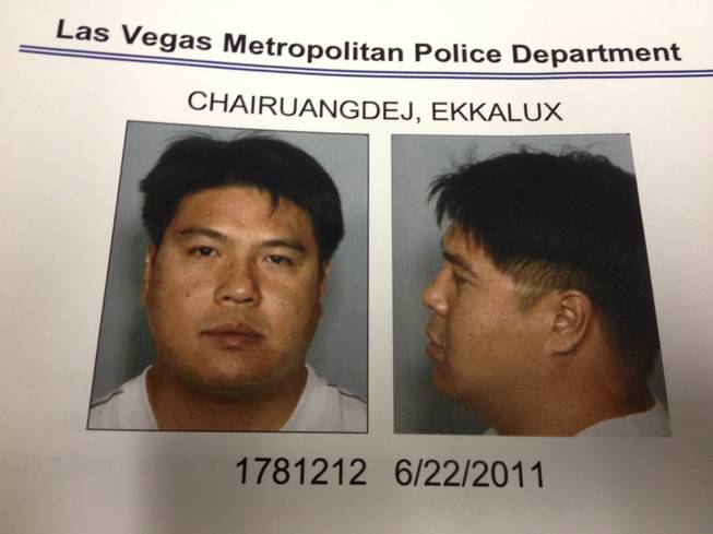 Police mugshots of Ekkalux Chairuangdej, accused of nine counts of possessing child pornography in Clark County and thought to be on the run in Thailand.