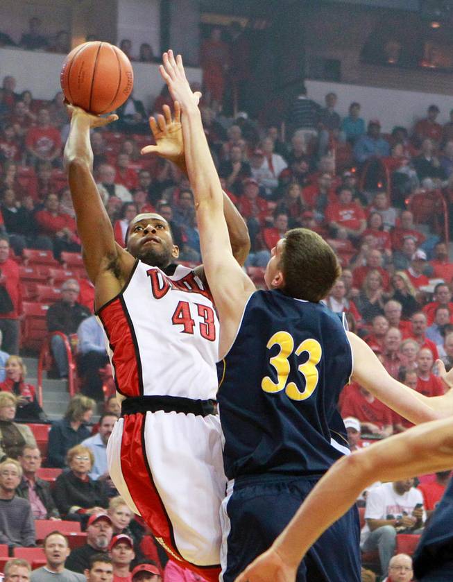 UNLV forward Mike Moser shoots over UC Irvine center Mike Best during their game Wednesday, Nov. 28, 2012 at the Thomas & Mack. UNLV won the game 85-57.