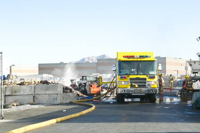North Las Vegas Firefighters battle a fire at Secured Fibres, a recycling and waste management company near Craig Road and Interstate 15, Wednesday, Nov. 28, 2012.