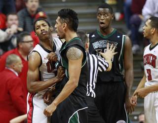 UNLV guard Justin Hawkins shoves Hawaii guard Jace Tavita out of his face while Hawaii center Vander Joaquim reacts to being called for a technical foul during their game Saturday, Dec. 1, 2012 at the Thomas & Mack. Hawkins also received a technical foul for the altercation with Joaquim. UNLV won 77-63