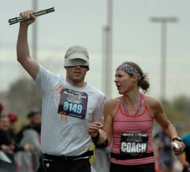 E.J. Scott, who is going blind from a degenerative eye disease called Choroideremia, is running 12 marathons in 12 months. He runs with a guide while wearing a blindfold to raise money and awareness.