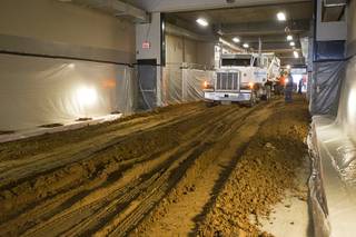 8:00 a.m. - Workers start spreading dirt in the east tunnel as they prepare the Thomas & Mack Center for the National Finals Rodeo Sunday, Dec. 2, 2012. This year's NFR begins Thursday, Dec. 6 and runs through Saturday Dec. 15.