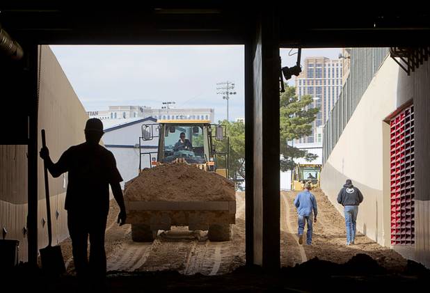 A front end loader brings more dirt into the Thomas & Mack Center for the National Finals Rodeo Sunday, Dec. 2, 2012. This year's NFR begins Thursday, Dec. 6 and runs through Saturday Dec. 15.