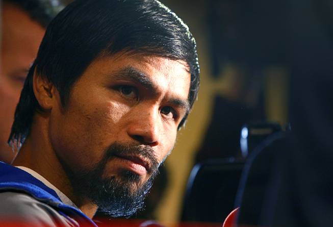 Filipino boxer Manny Pacquiao listens to a reporter's question during an interview at the MGM Grand Tuesday, December 4, 2012. Pacquiao will take on Juan Manuel Marquez of Mexico in a welterweight bout at the MGM Grand Garden Arena on Saturday. It will be the fourth time for the boxers to fight each other.