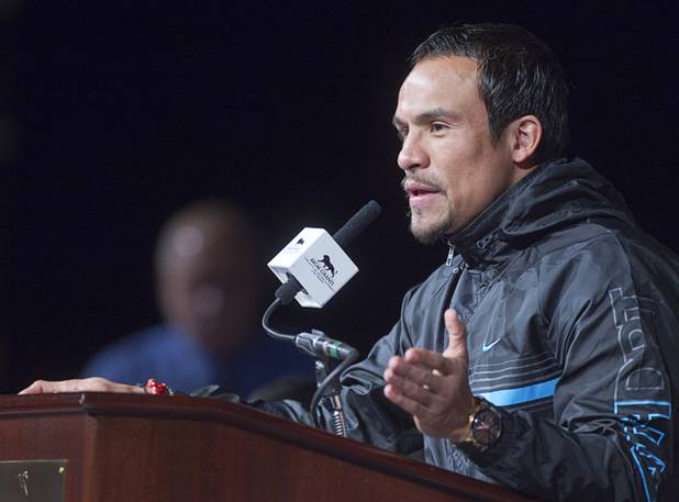 Boxer Juan Manuel Marquez of Mexico speaks during a news conference at the MGM Grand Wednesday, Dec. 5, 2012. Marquez and Filipino boxer Manny Pacquiao will fight for a fourth time in a welterweight bout at the MGM Grand Garden Arena Saturday.