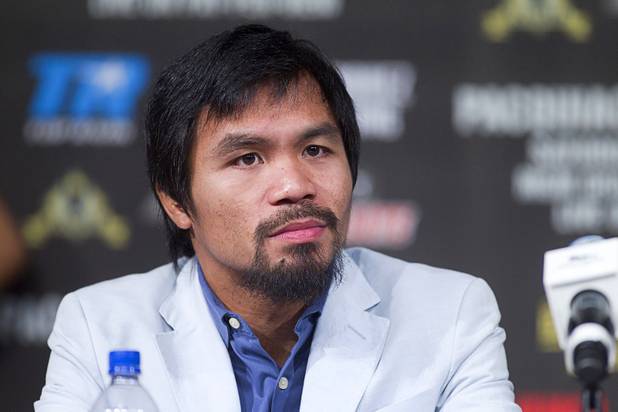 Filipino boxer Manny Pacquiao attends a news conference at the MGM Grand Wednesday, Dec. 5, 2012. 