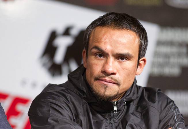 Mexican boxer Juan Manuel Marquez attends a news conference at the MGM Grand Wednesday, Dec. 5, 2012. Marquez and Filipino boxer Manny Pacquiao will fight for a fourth time in a welterweight bout at the MGM Grand Garden Arena Saturday.