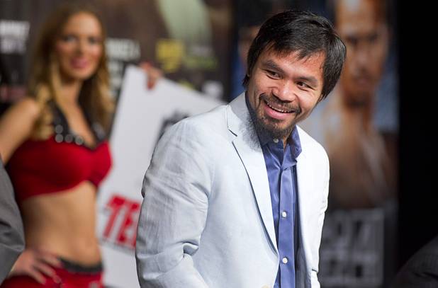 Boxer Manny Pacquiao smiles during a news conference at MGM Grand on Wednesday, Dec. 5, 2012. Pacquiao and Juan Manuel Marquez will fight for a fourth time in a welterweight bout at MGM Grand Garden Arena on Saturday.