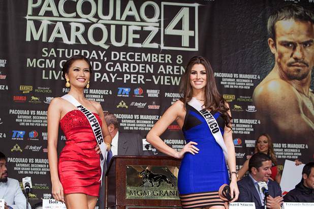 Miss Universe contestants Miss Philippines Janine Tugonon and Miss Mexico Karina Gonzalez pose during a boxing news conference at the MGM Grand Wednesday, Dec. 5, 2012. Manny Pacquiao and Juan Manuel Marquez will fight for a fourth time in a welterweight bout at the MGM Grand Garden Arena Saturday.