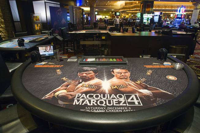 A blackjack table with images of Filipino boxer Manny Pacquiao and Juan Manuel Marquez of Mexico is displayed on the casino floor at the MGM Grand Wednesday, Dec. 5, 2012. Pacquiao and Marquez will fight for a fourth time in a welterweight bout at the MGM Grand Garden Arena Saturday.
