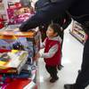 Romeo Salango, 4, looks over his presents at the checkout line during an annual Shop With A Cop event at the Target store at 2189 W. Craig Rd. in North Las Vegas, Wednesday, December 5, 2012.